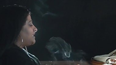 Indian lady smokes. Great talk exhales.