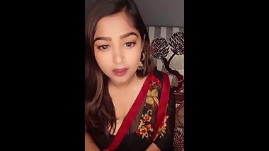 Pretty Indian Girl Showing Cleavage in Red and Black sari